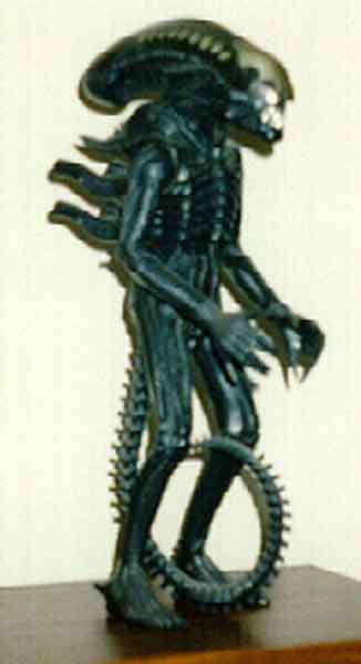 A real old picture of a beat-up doll.